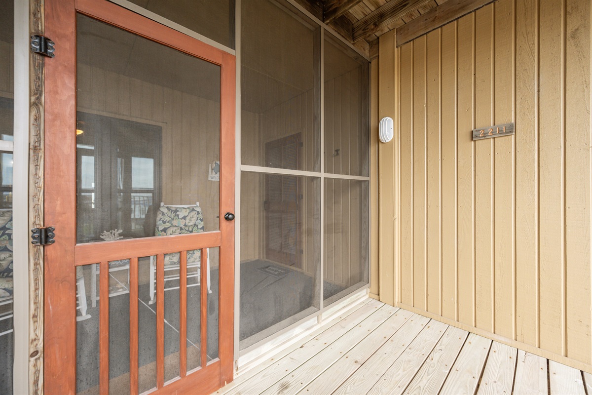Screened-in porch, ideal for enjoying the outdoors while staying sheltered 