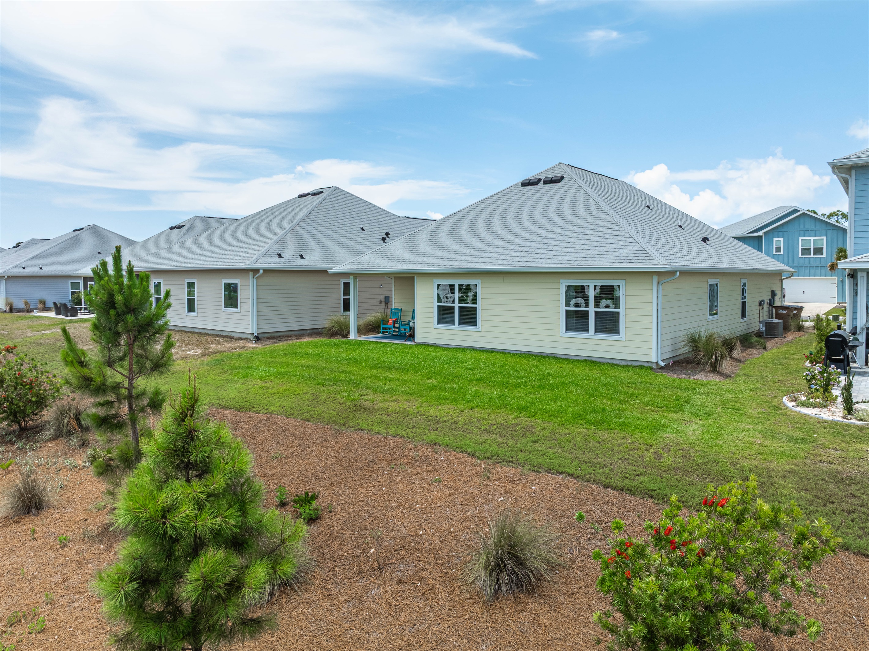 Step out back to a serene pond view — the perfect spot for your morning coffee, an afternoon read, or simply unwinding after a beach day.