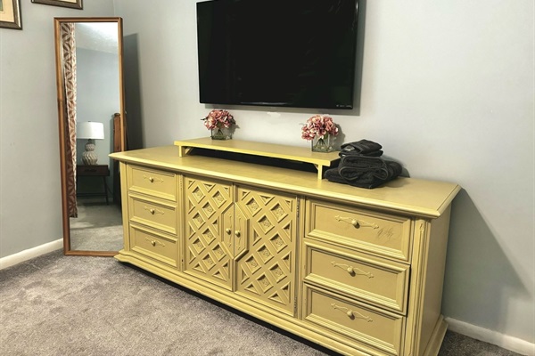 Primary Bedroom: Antique dresser, Full length mirror.  50” Sony TV.