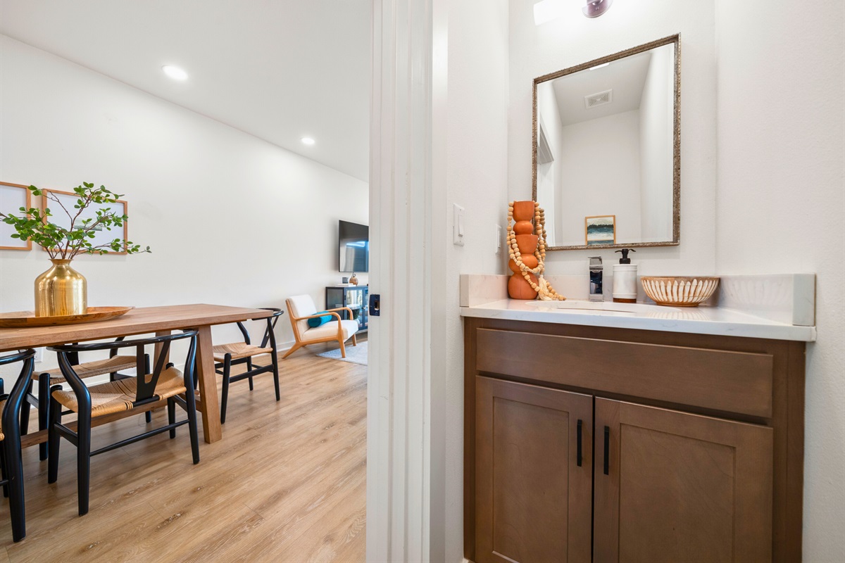 Stylish entryway connecting the dining and living areas with modern touches and warm wood finishes.