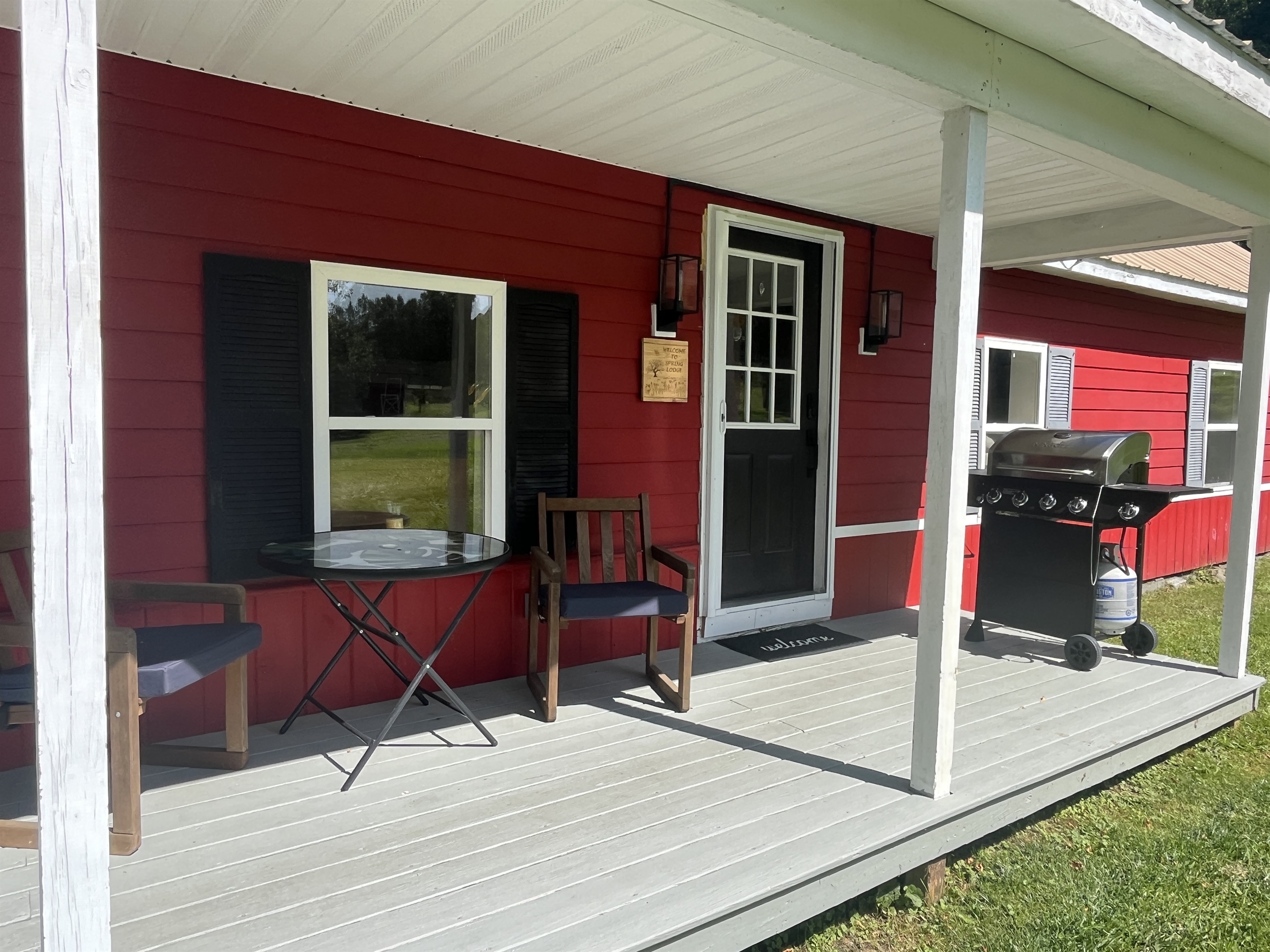 BBQ grill on covered front porch