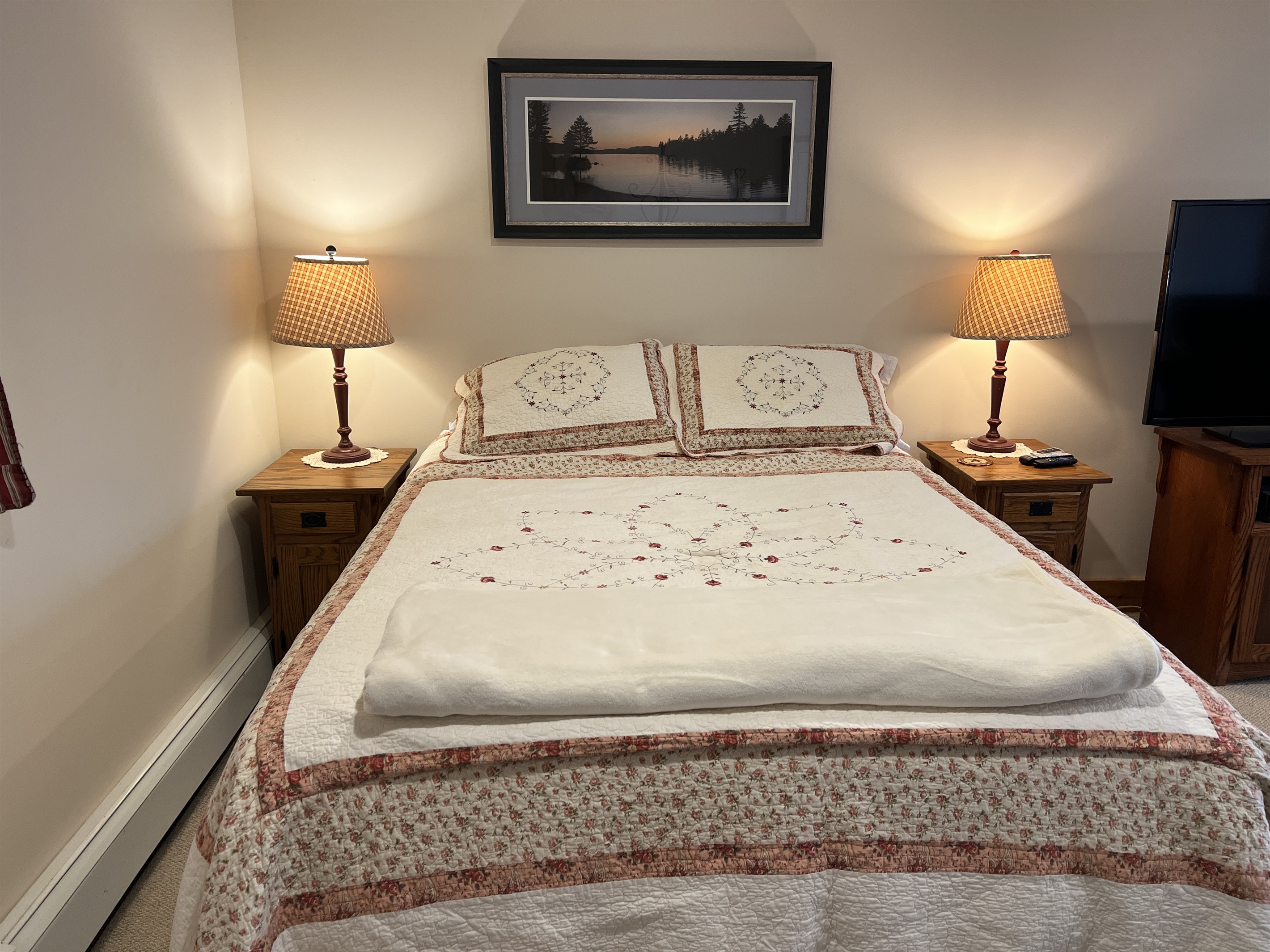 Queen bed in studio living area