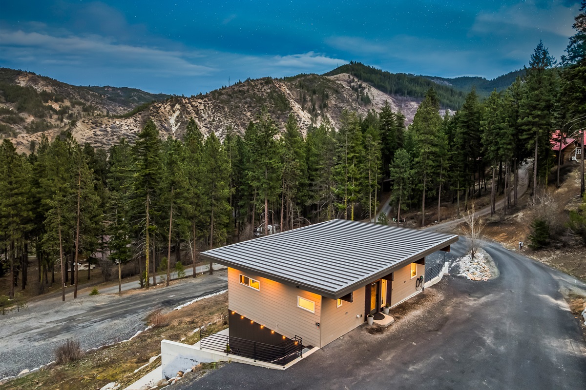 Front entrance and parking area for two vehicles, plus EV charger