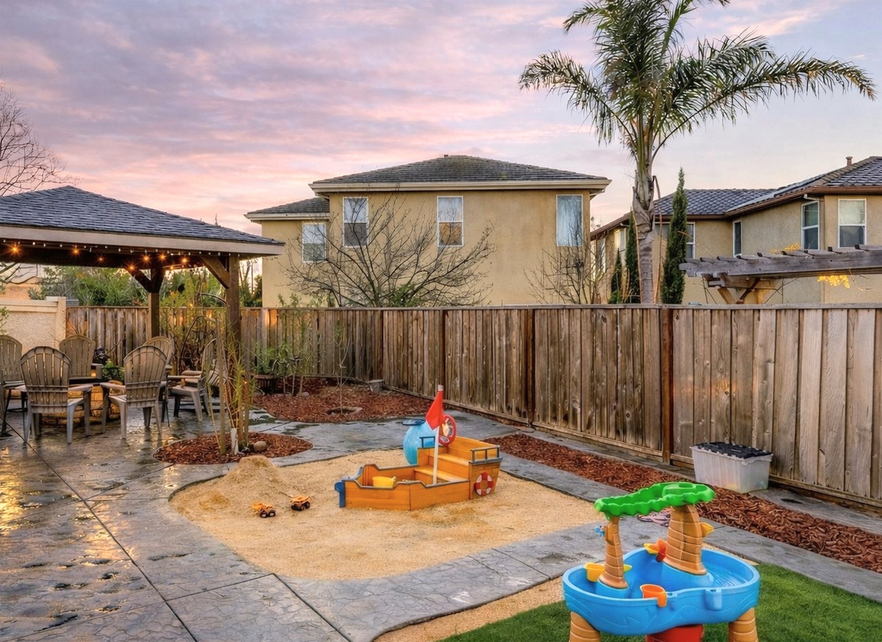Spacious backyard with multiple activity areas