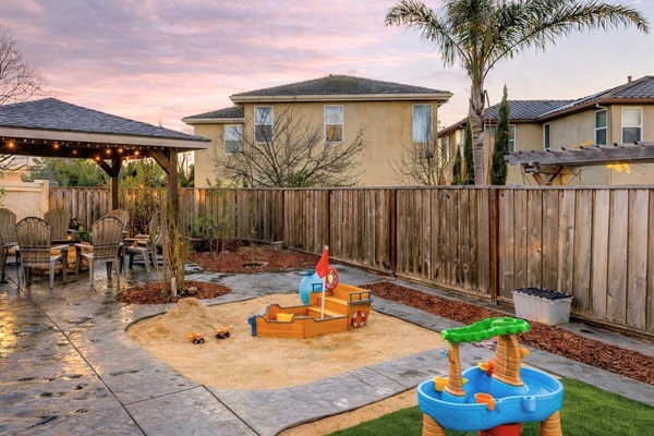 Spacious backyard with multiple activity areas
