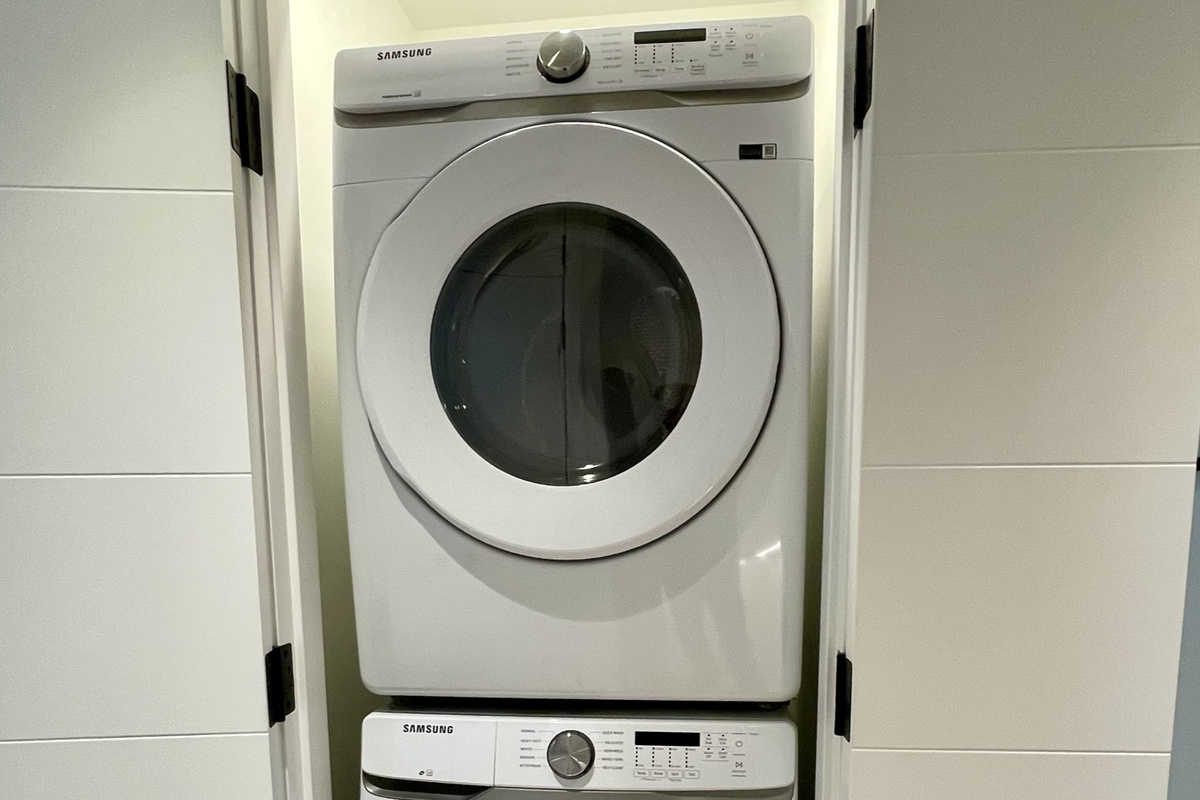 Stacked washer and dryer in closet