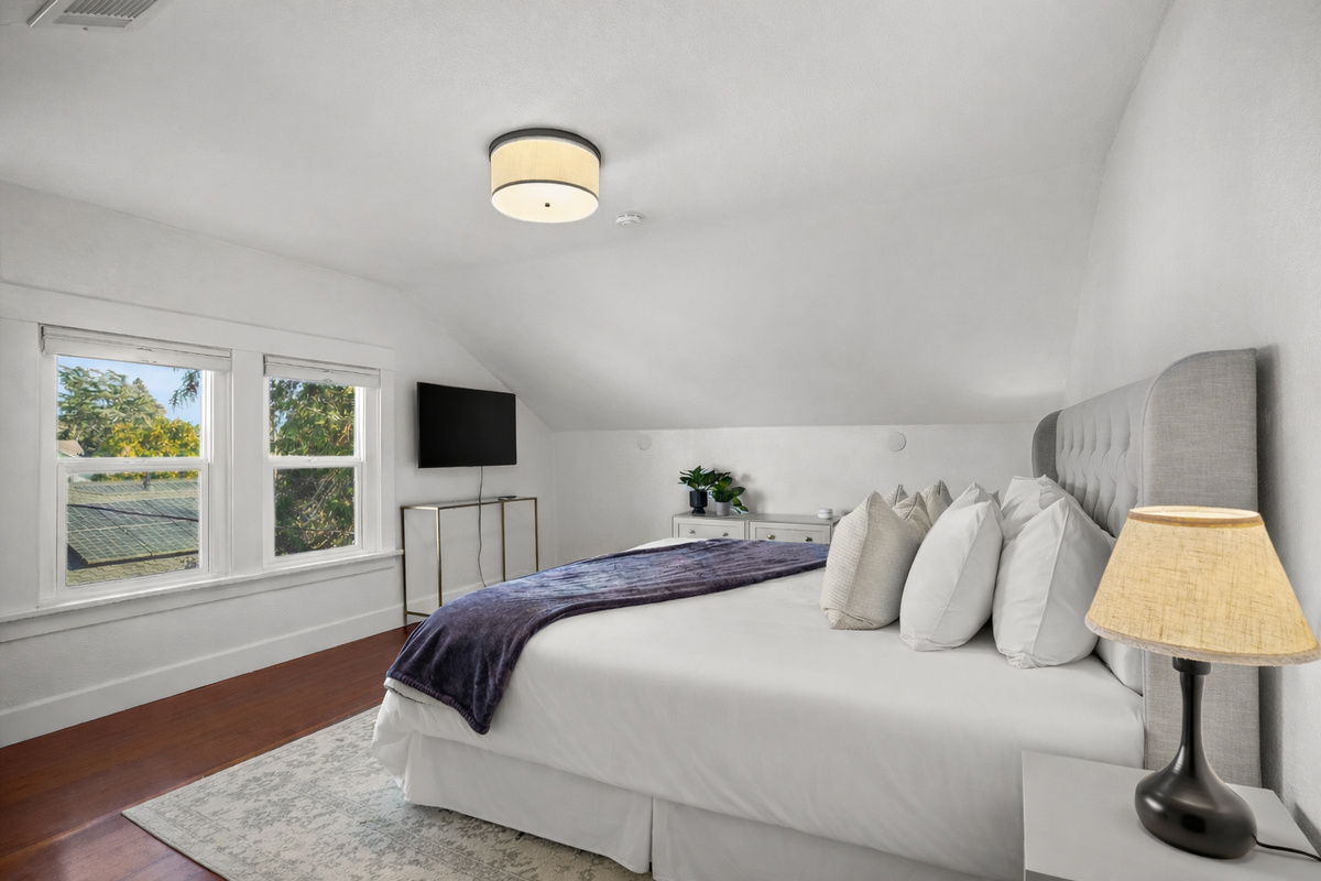 Unwind in the spacious primary bedroom featuring a comfortable king bed, Smart TV, and a large closet for all your belongings. Designed with comfort in mind, it's the perfect private retreat after a day of exploring Napa Valley.