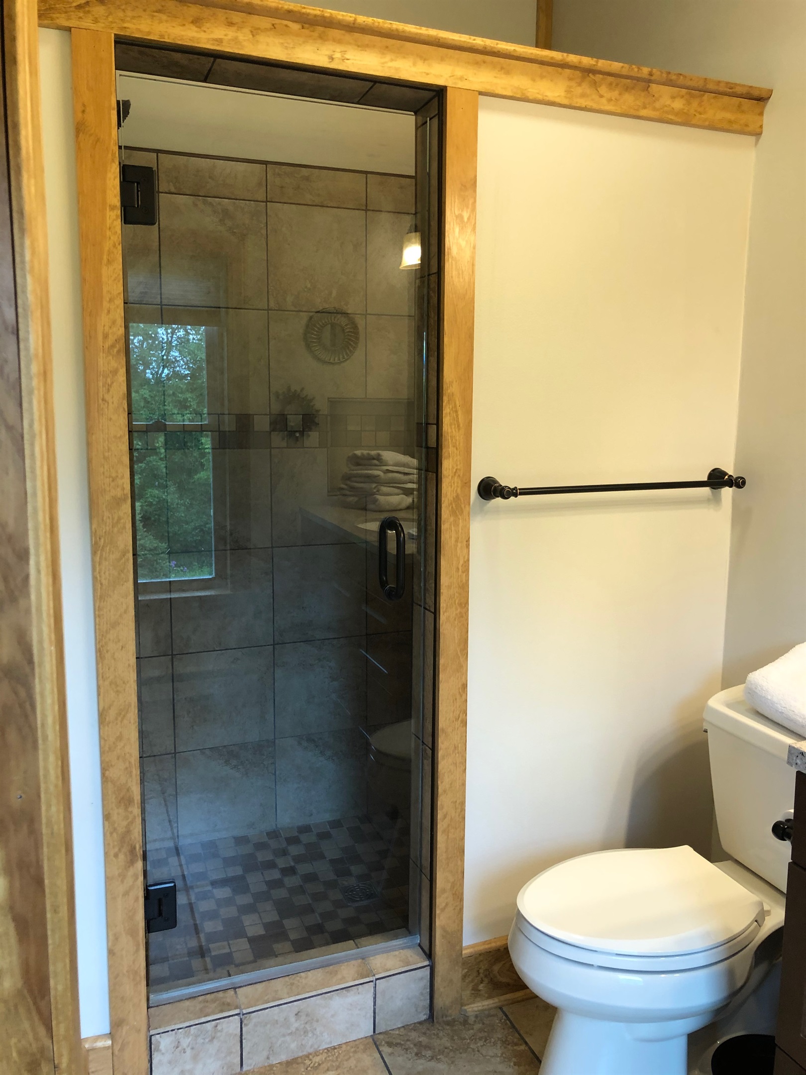 Ensuite bathroom with frameless glass shower.