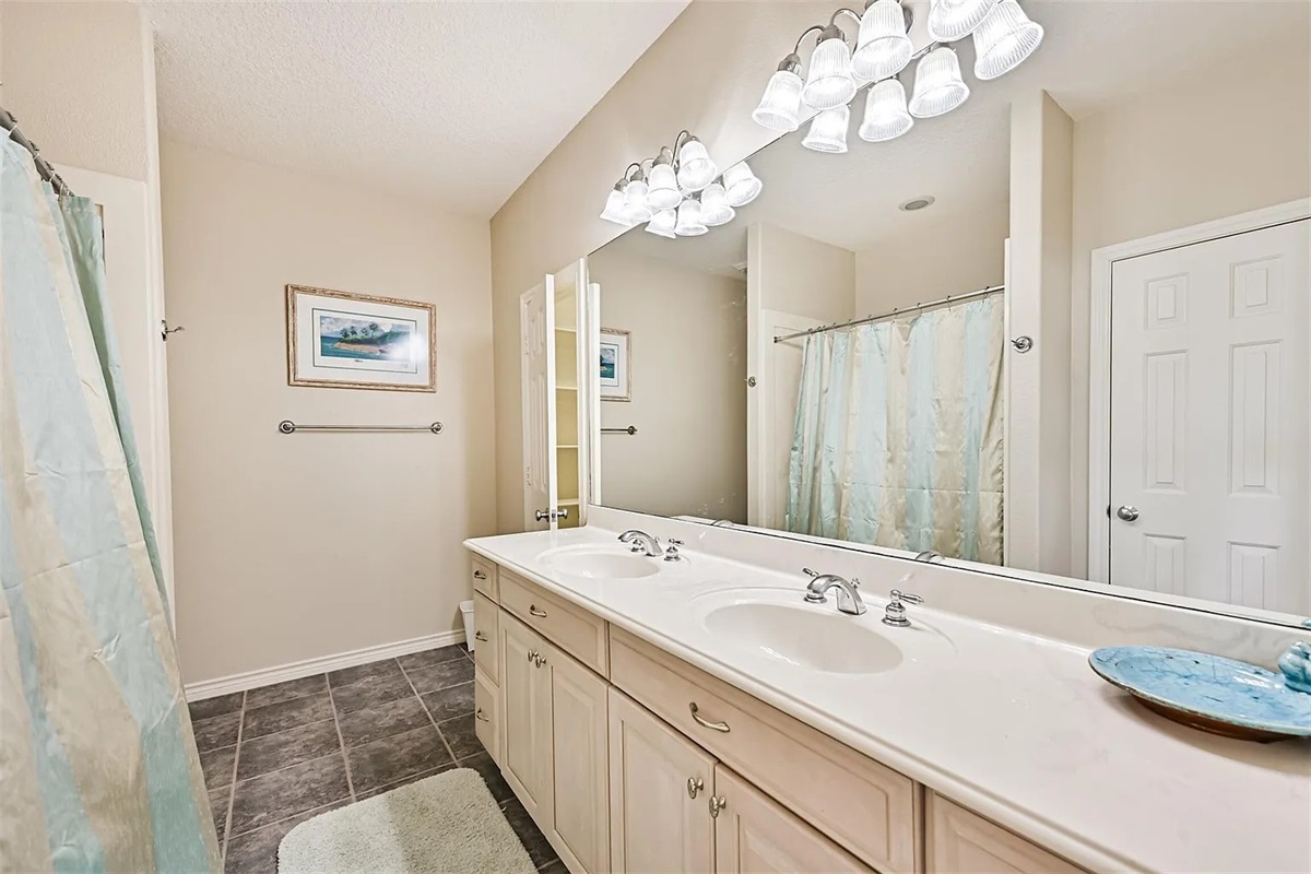 Private Ensuite bathroom for the Primary Bedroom, double vanity, jetted tub, and shower