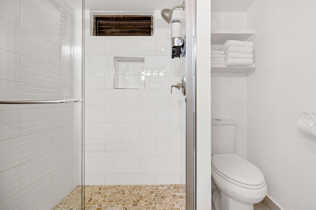 Refreshing walk-in shower featuring a bright and comfortable space to unwind.