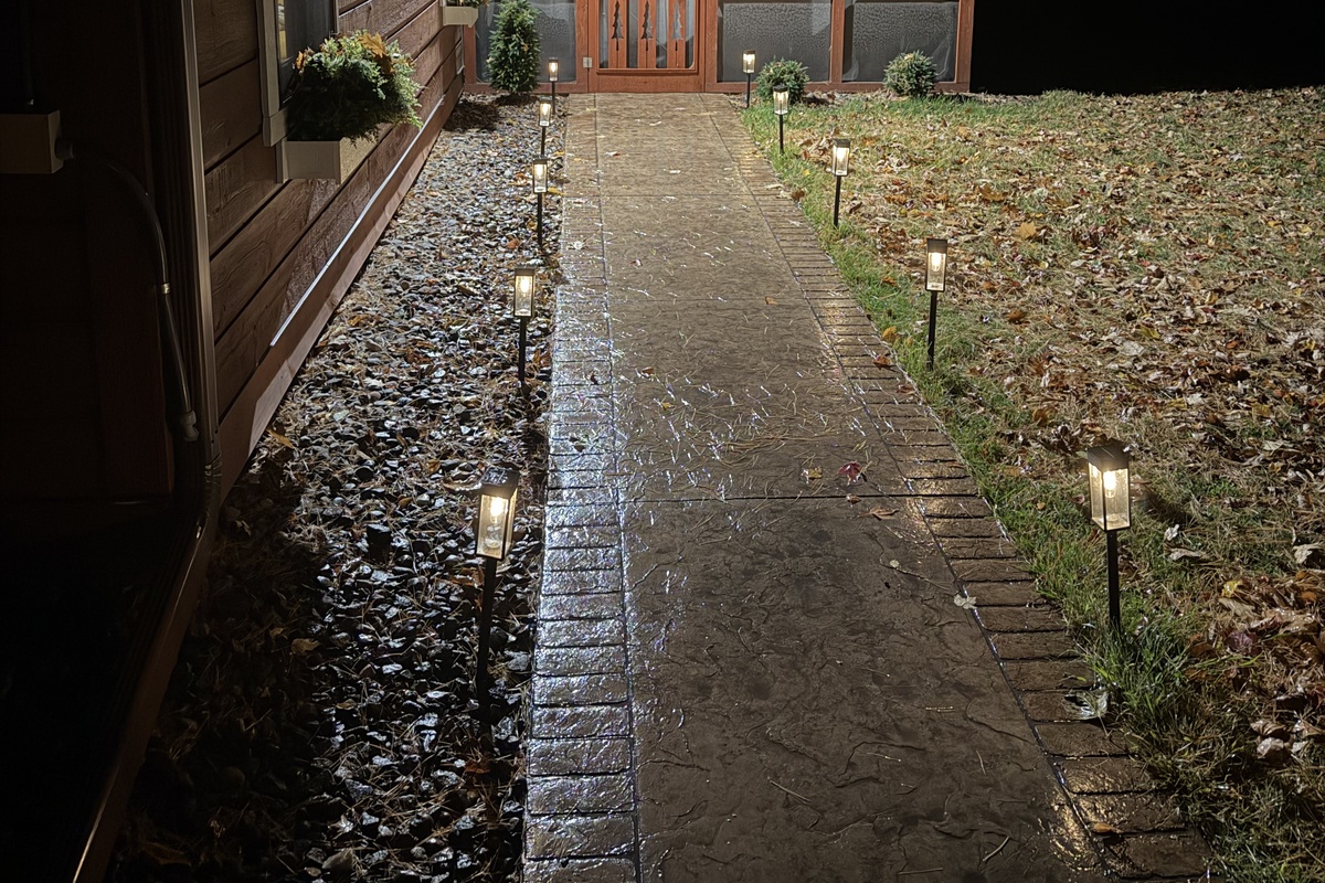 The front walk to the screen porch at night.