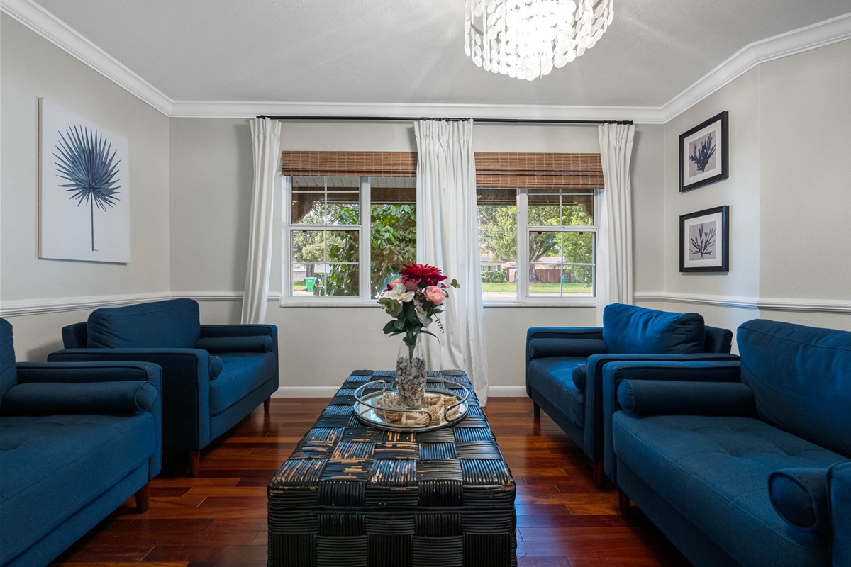The large windows frame lovely views of the outdoors while providing a bright and airy atmosphere.