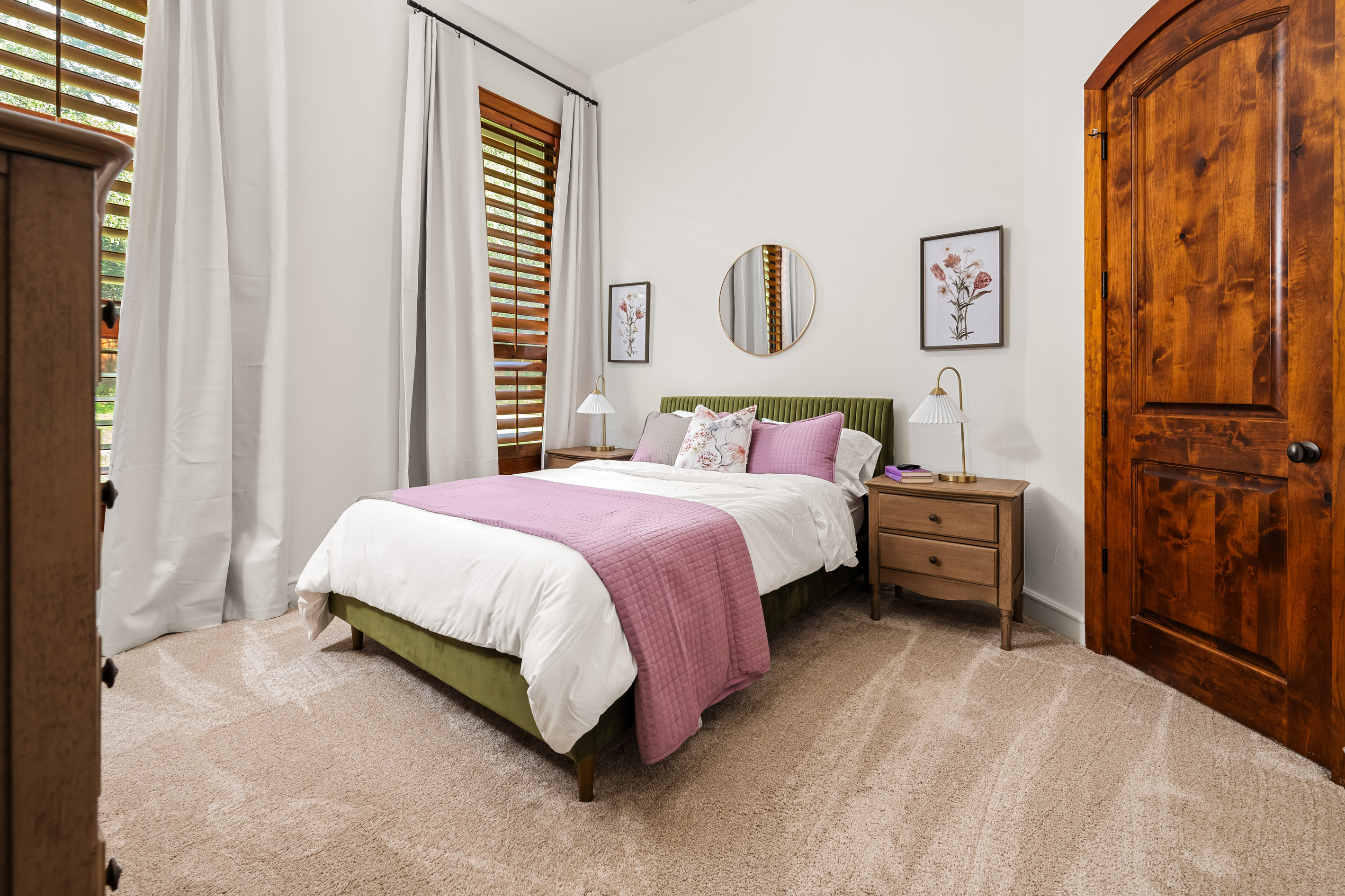 Relax and recharge in refined comfort in this bedroom with its queen-size bed.