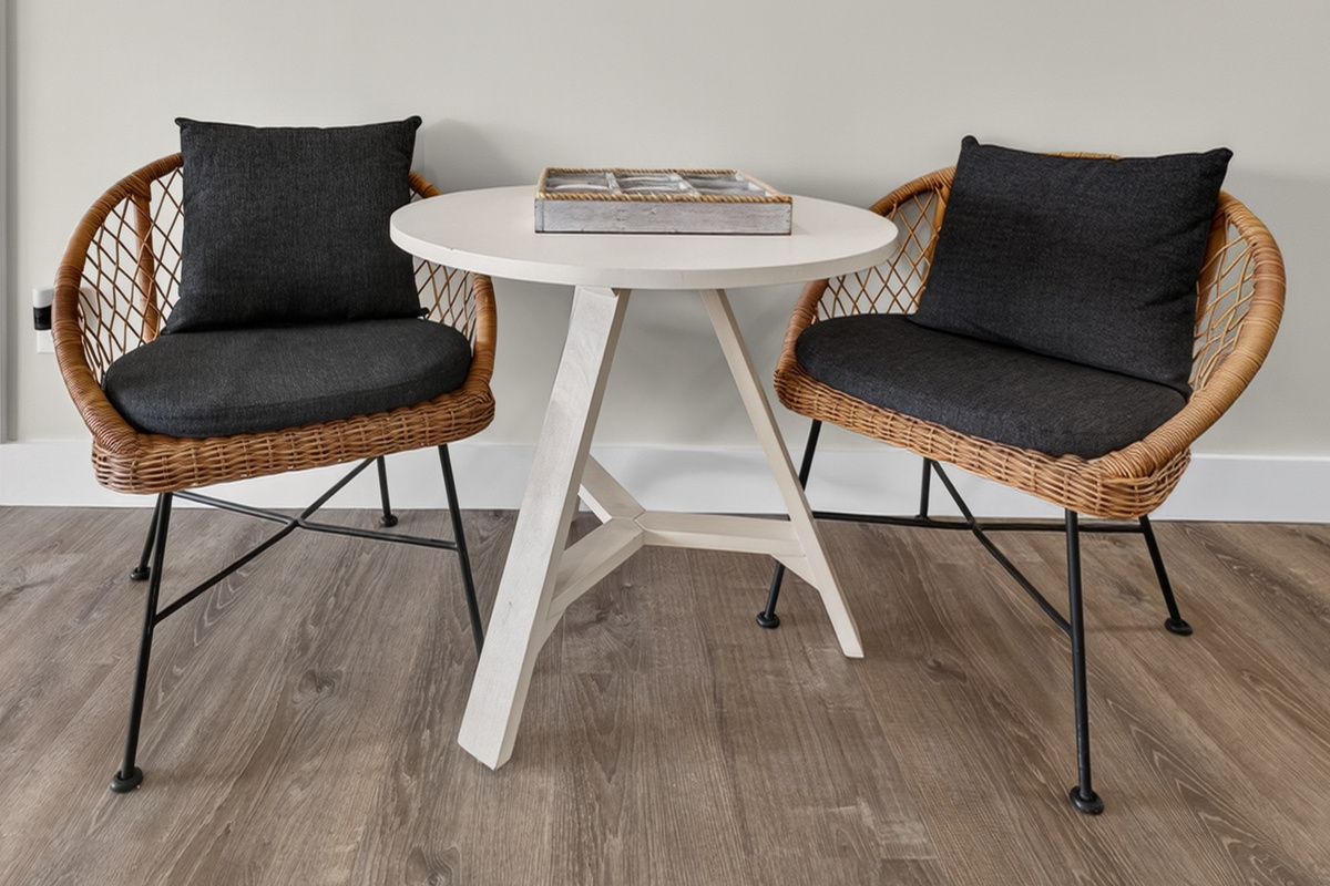 Intimate breakfast nook with modern chairs, perfect for morning coffee or casual meals.