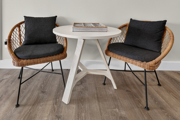 Intimate breakfast nook with modern chairs, perfect for morning coffee or casual meals.