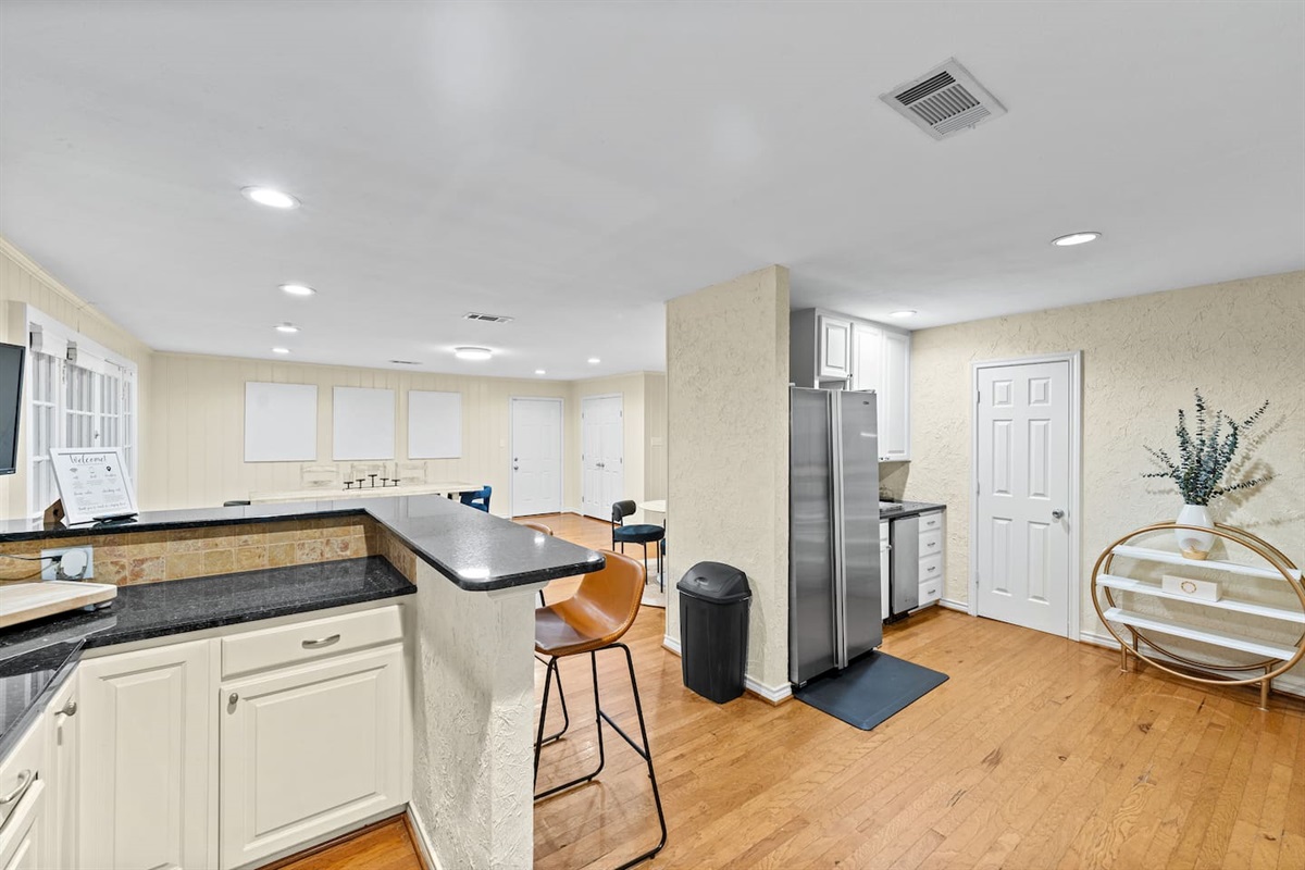 Spacious and seamless design ties together the kitchen, dining, and living areas for effortless flow and easy gathering.