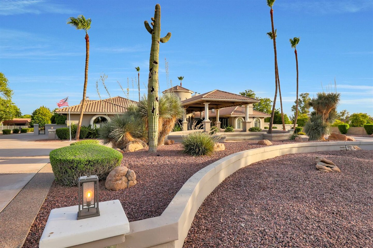Unique desert plants and cacti enhance the beauty of the front yard, showcasing Arizona’s natural elegance.