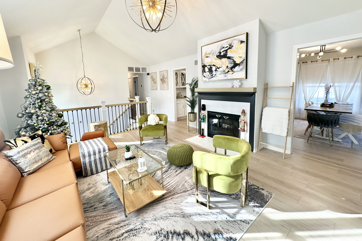 Beautiful living room with soaring vaulted ceilings. A festive Christmas tree will be set up for the holiday season! 🎄