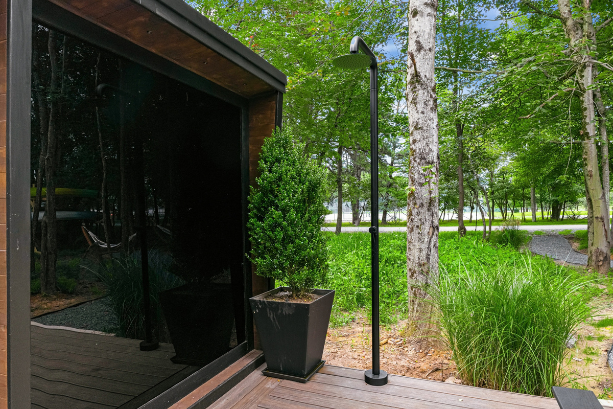 The sauna at the edge of the trees