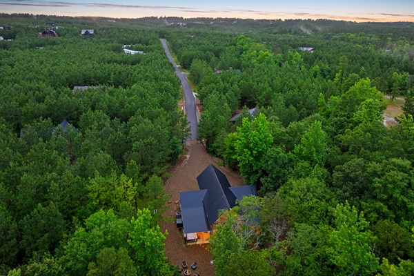 The cabin is at the end of the road, in a secluded lot