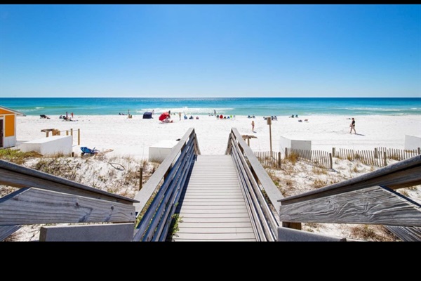 White sand private beach and Emerald water just outside building