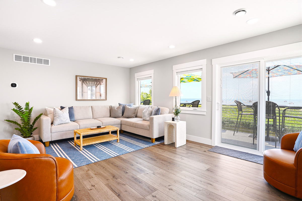 Welcome to your second-floor gathering space—a bright and inviting lounge featuring a spacious sectional sofa, cozy entertainment area, and beautiful Lake St. Clair views. It's the perfect place to relax, reconnect, and make lasting memories together.