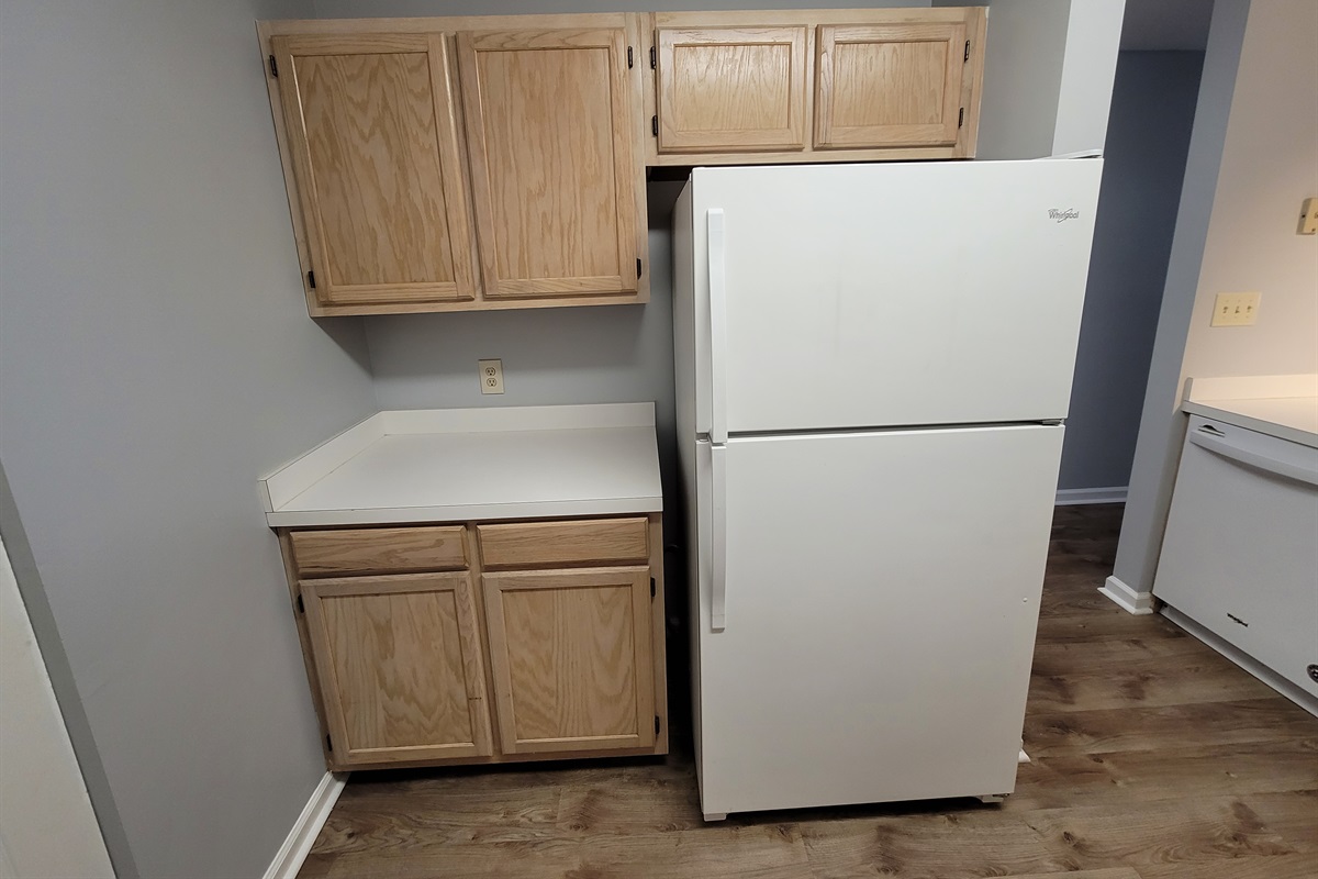 Full refrigerator and freezer with ice maker.