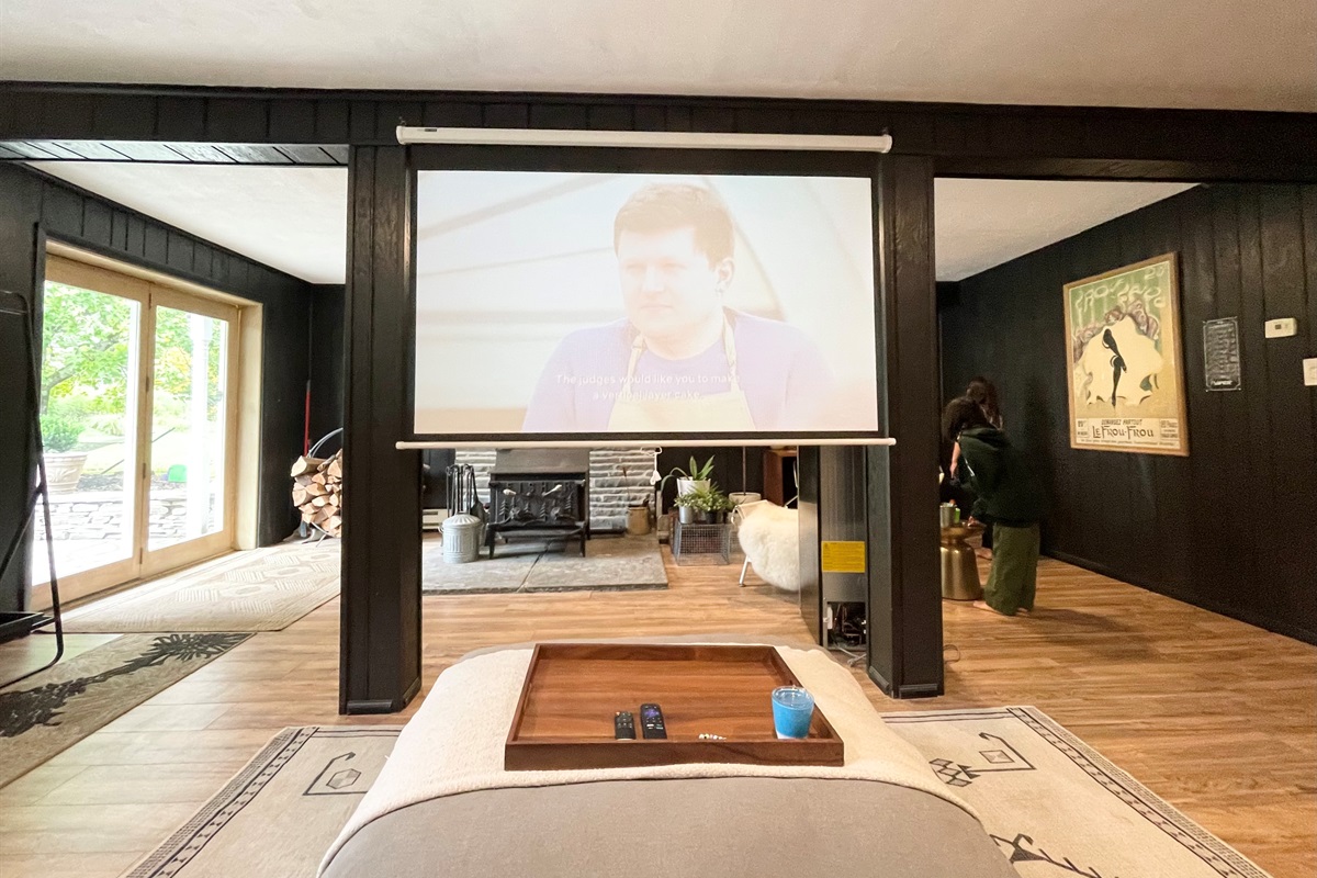 Family with projector and 100" screen