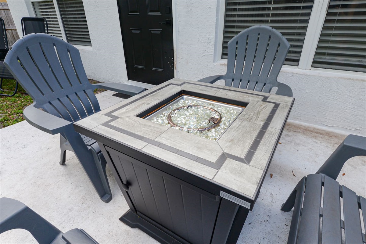 Backyard featuring a unique table, adding a touch of style and charm to your outdoor space.