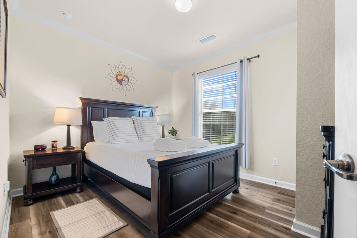 Bright and airy bedroom 2 with a queen bed for a relaxing stay.