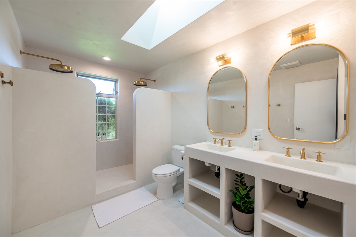 Moroccan (Tedelakt) plaster bathroom with Kohler fixtures, dual rain shower