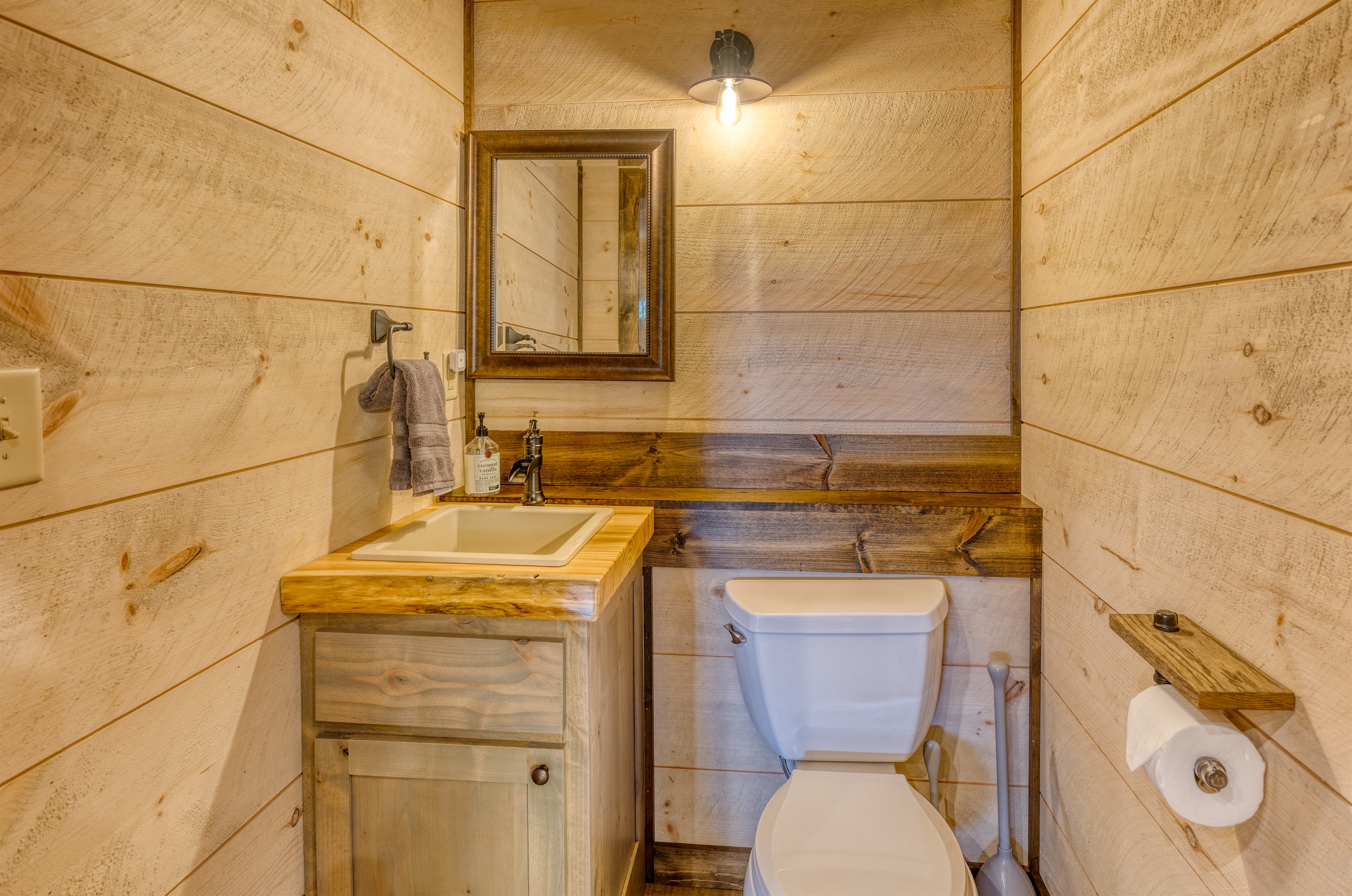 Rustic but elegant bathroom located in the arcade. Also a full bathroom located upstairs in the private apartment.