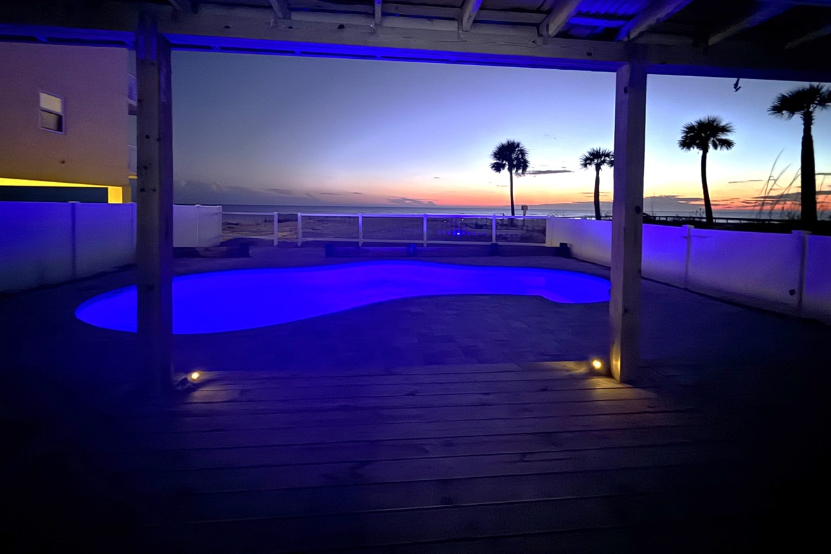 Beautiful Sunsets and a Beach View off your Private Deck Overlooking a Pool.