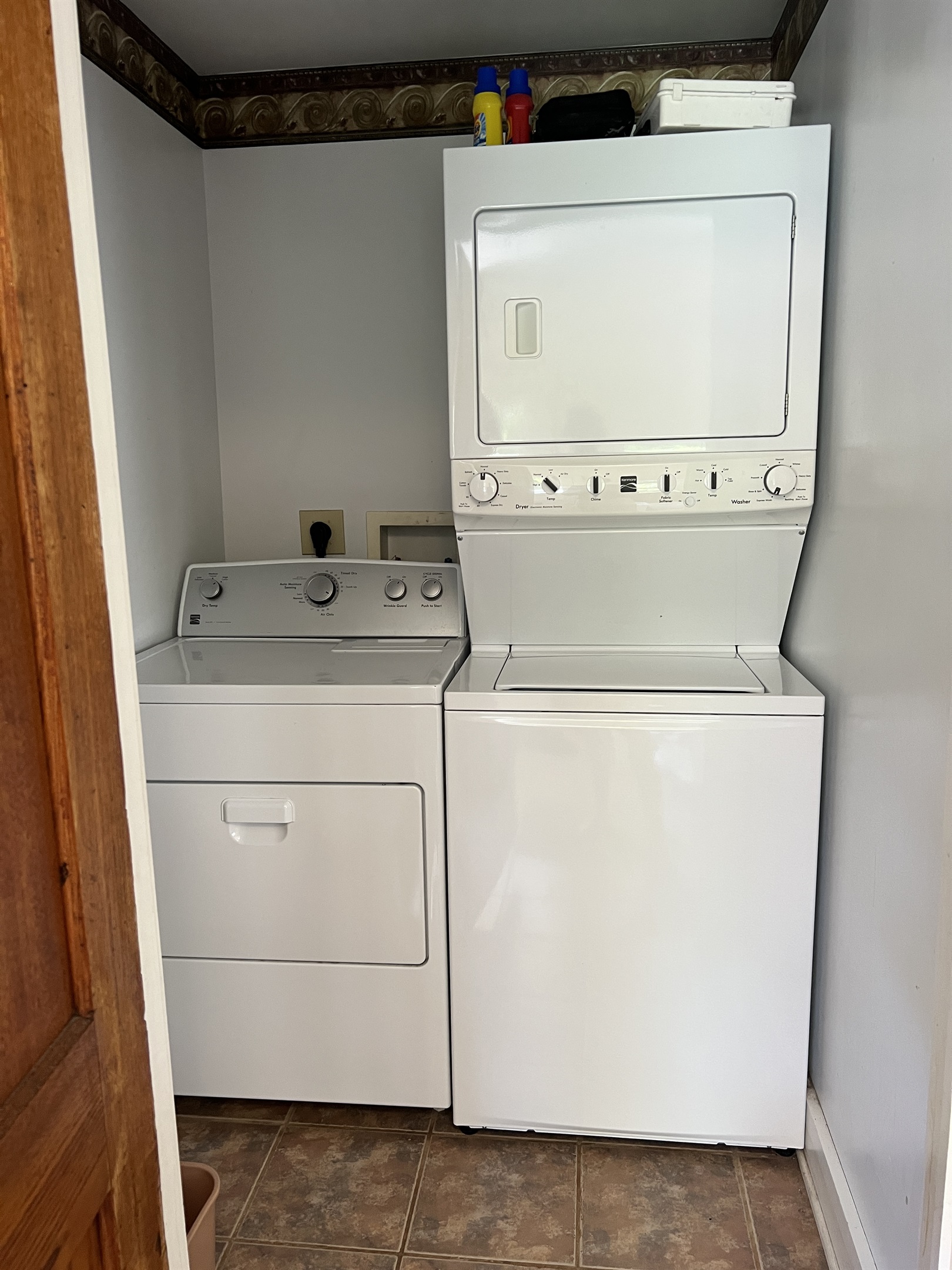 The Federal House entryway laundry area with 2 dryers