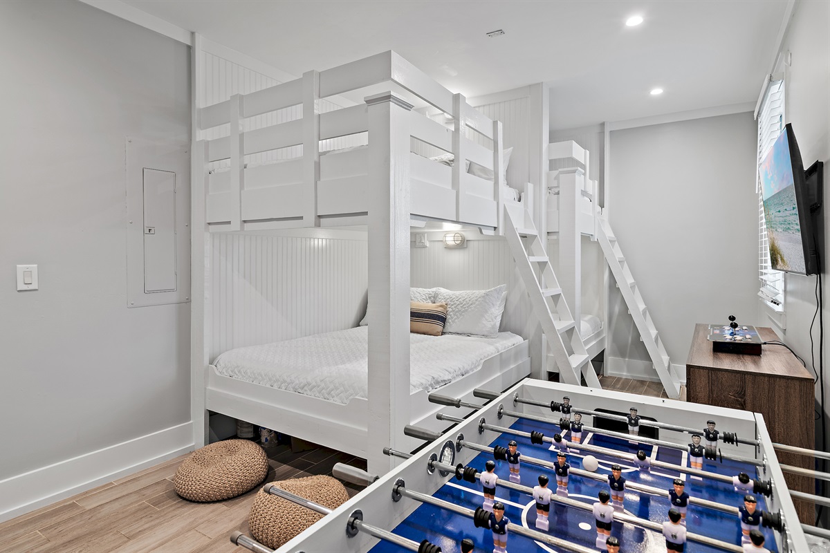 1st Floor - Bedroom 5: BUNK ROOM with Queen/Queen Bunk, Full/Full Bunk, Arcade Game, Foosball Table, Smart TV + Game Console with pre-loaded games (Sleeps 6-8)