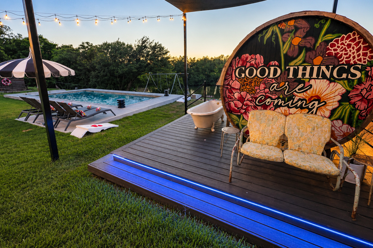 Good Things pool deck with string lights.