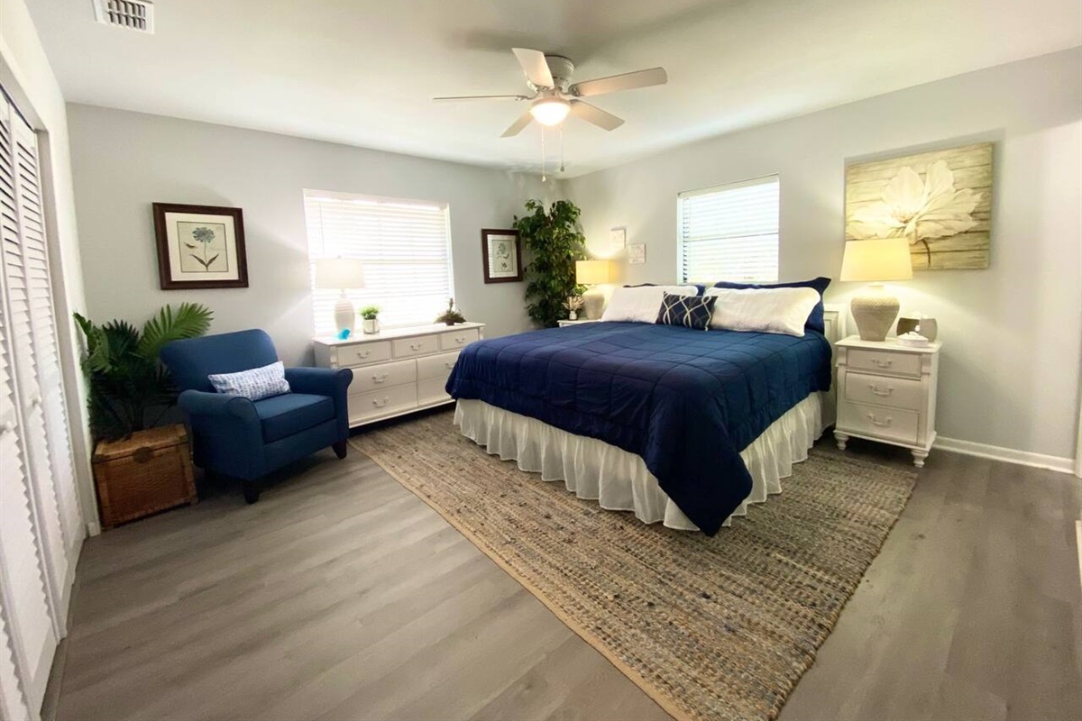 Spacious master bedroom with a comfortable king bed to enjoy a great night's sleep.