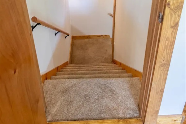 Stairs to downstairs from kitchen