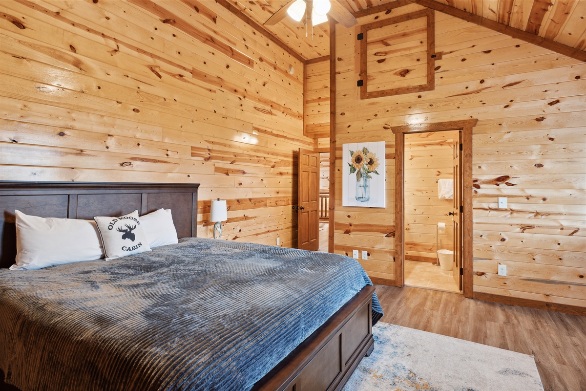 King bedroom with TV and full ensuite bathroom.