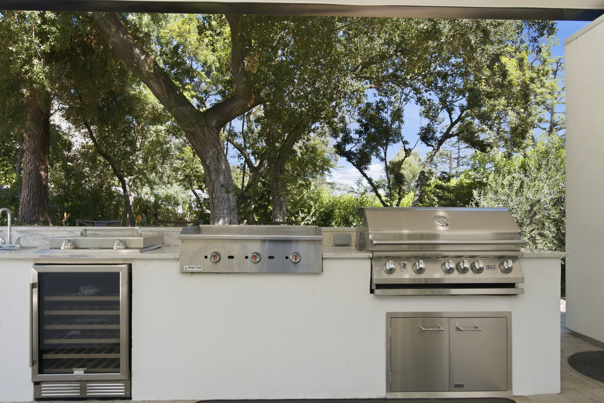Leads into the large dining space, offering ample seating and beautiful views of the surrounding greenery.