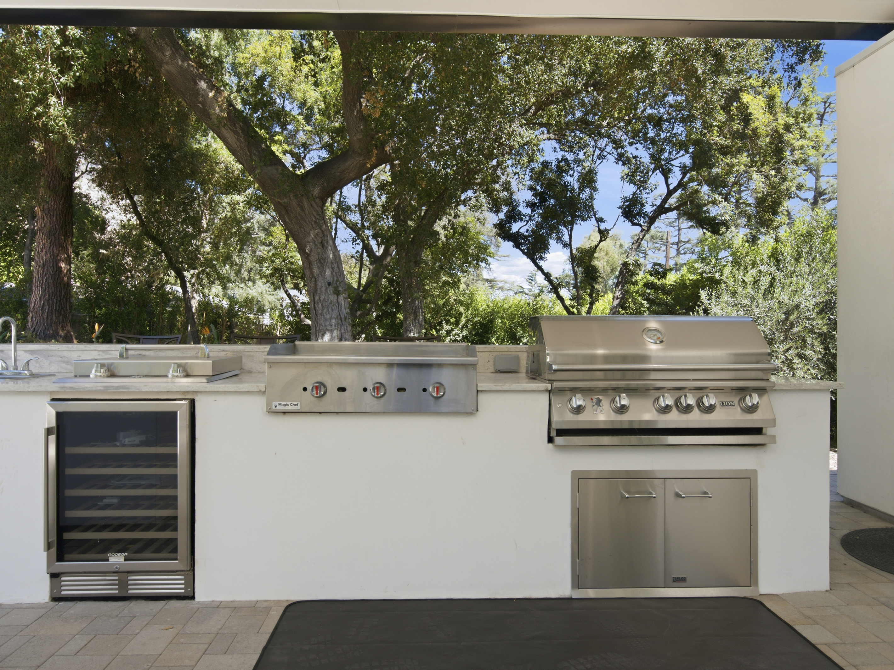 Leads into the large dining space, offering ample seating and beautiful views of the surrounding greenery.