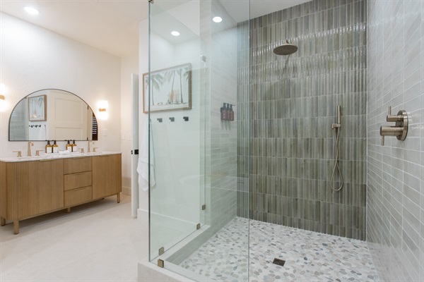 Rain shower, soaking tub, Epsom salt bar & double vanity—this ensuite bath might cause a few friendly arguments over who gets it.