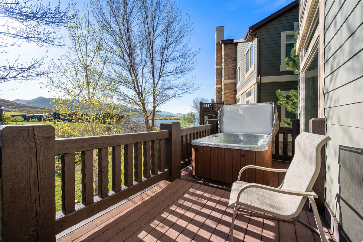 Scenic outdoor deck with seating and fresh mountain air just steps from the living room.