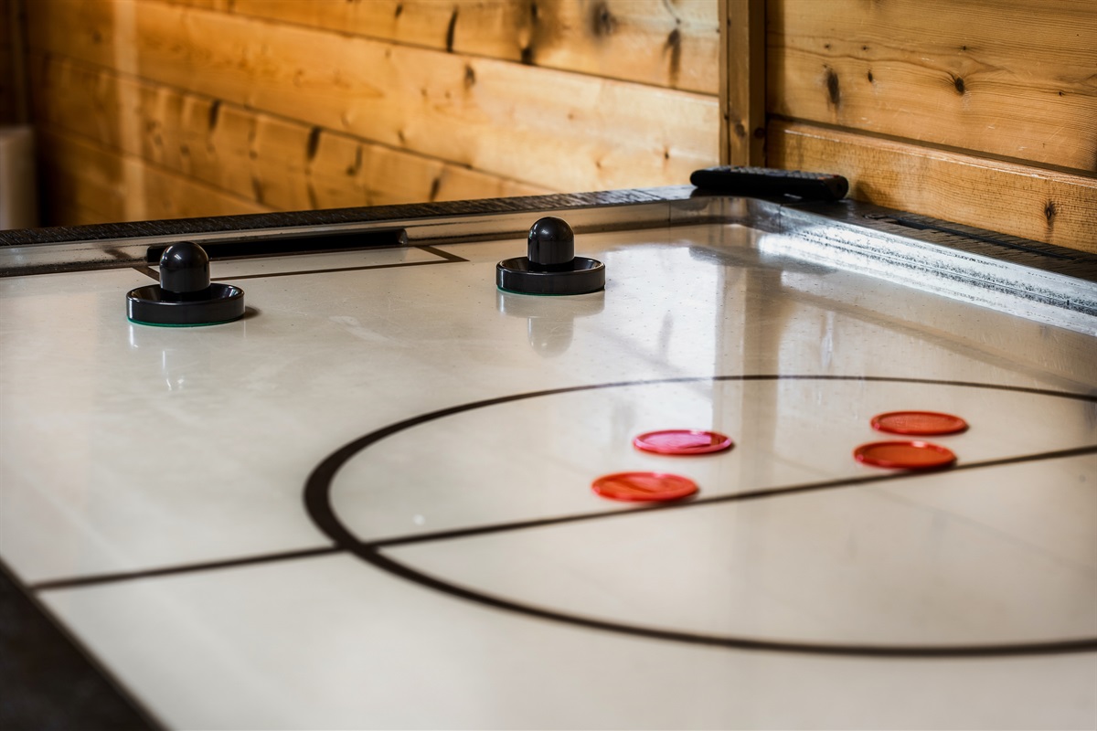 Try your hand at air hockey in our game room