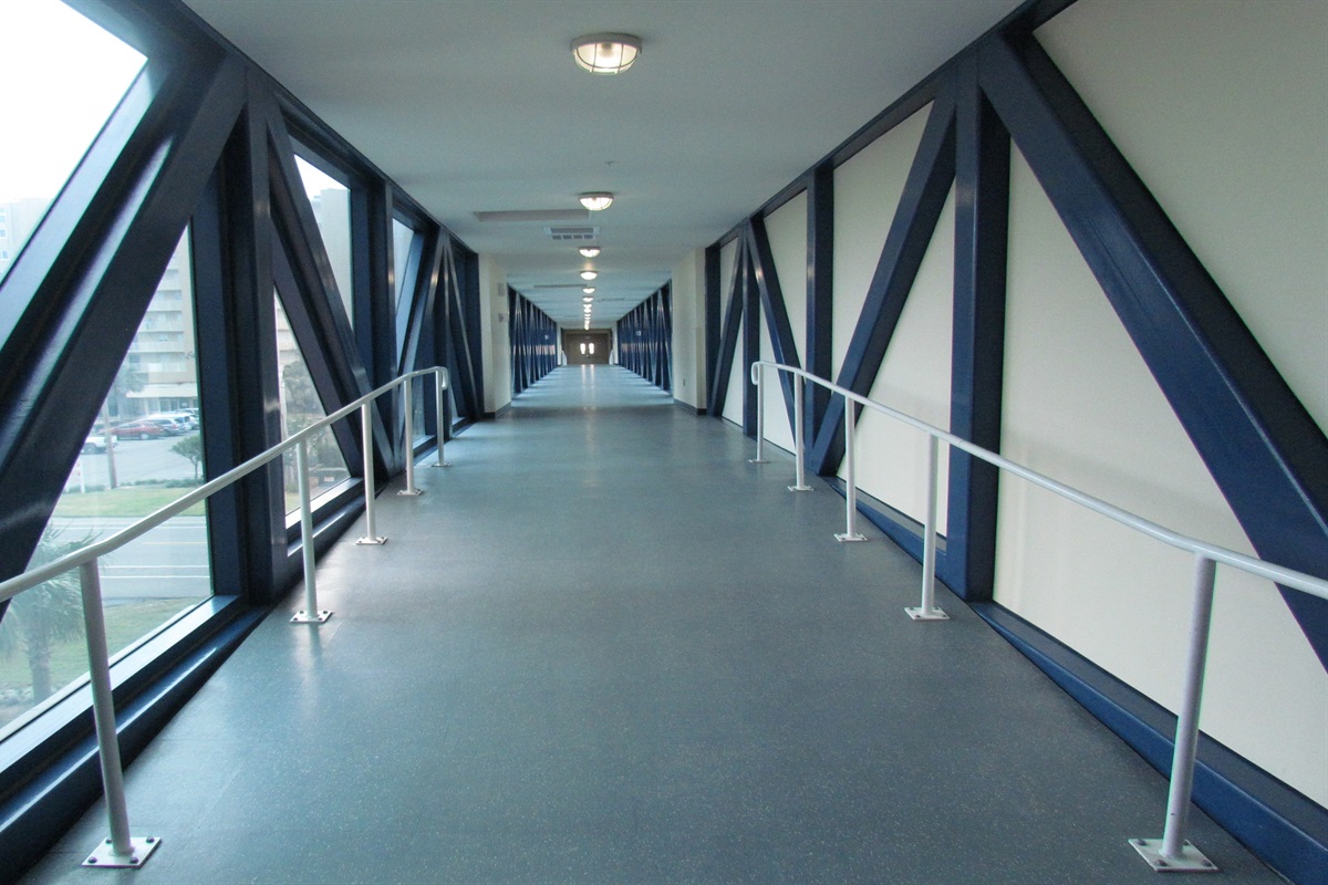 Architectural excellence meets coastal luxury at Crystal Tower. This striking, elevated, air-conditioned skybridge offers a safe and comfortable transition to the resort's stunning outdoor pool area and pristine beach.