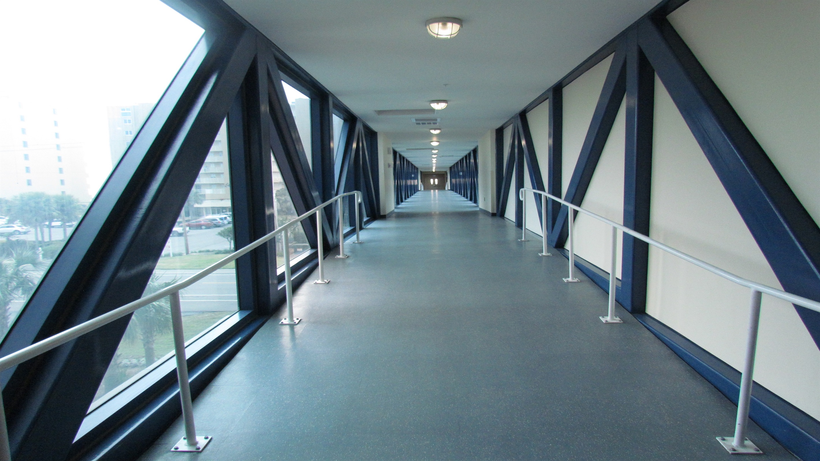 Architectural excellence meets coastal luxury at Crystal Tower. This striking, elevated, air-conditioned skybridge offers a safe and comfortable transition to the resort's stunning outdoor pool area and pristine beach.