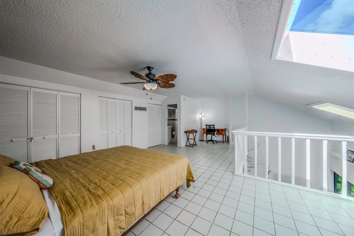 Enjoy the charm of this airy loft sleeping space with an open view of the home below.
