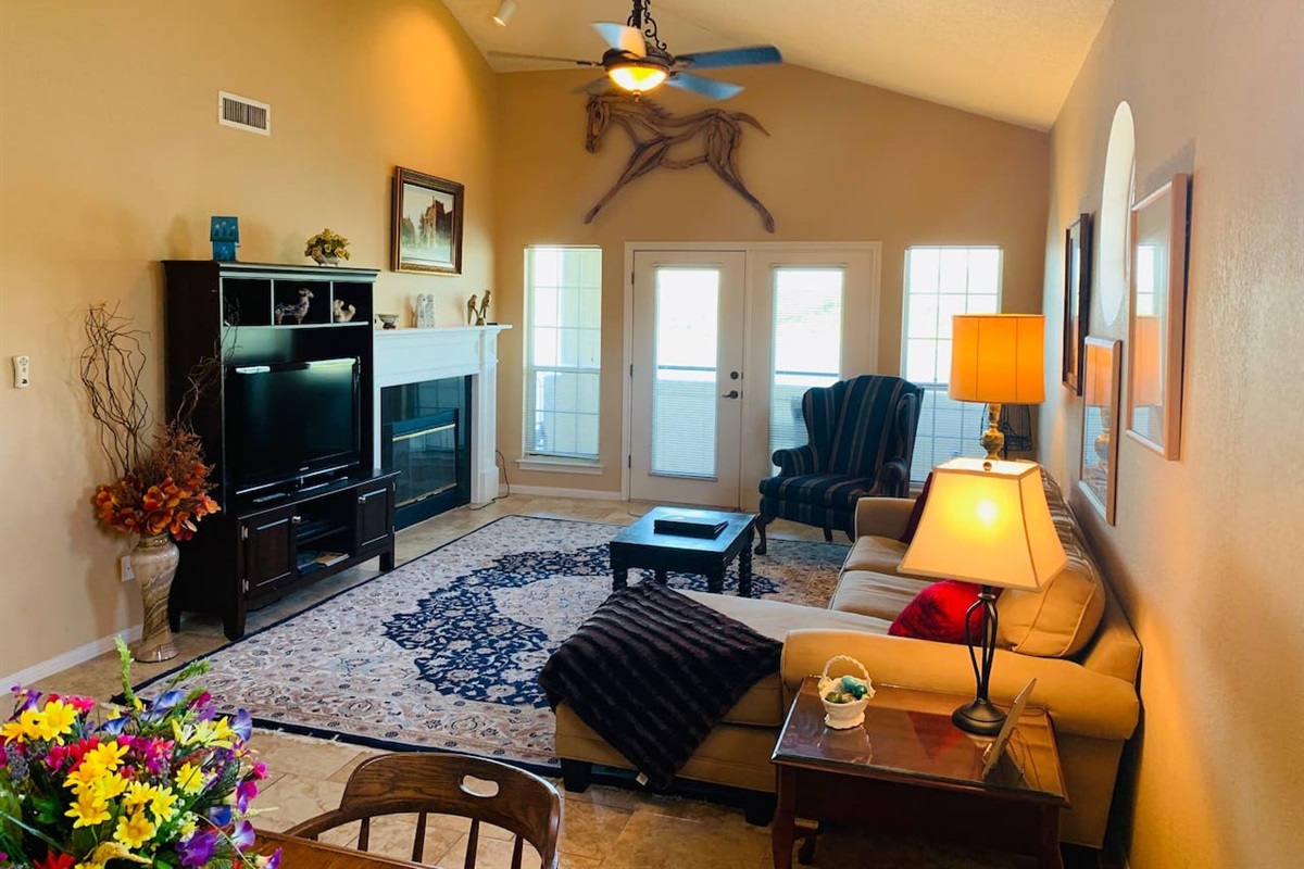 Living Area with Vaulted Ceilings & Warm Decor