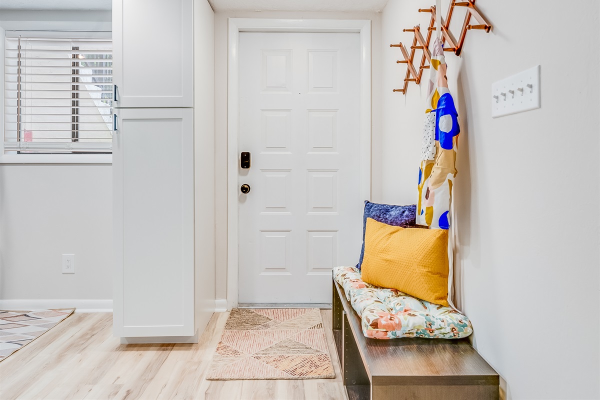 A convenient bench near the entrance is perfect for slipping off shoes and settling in.