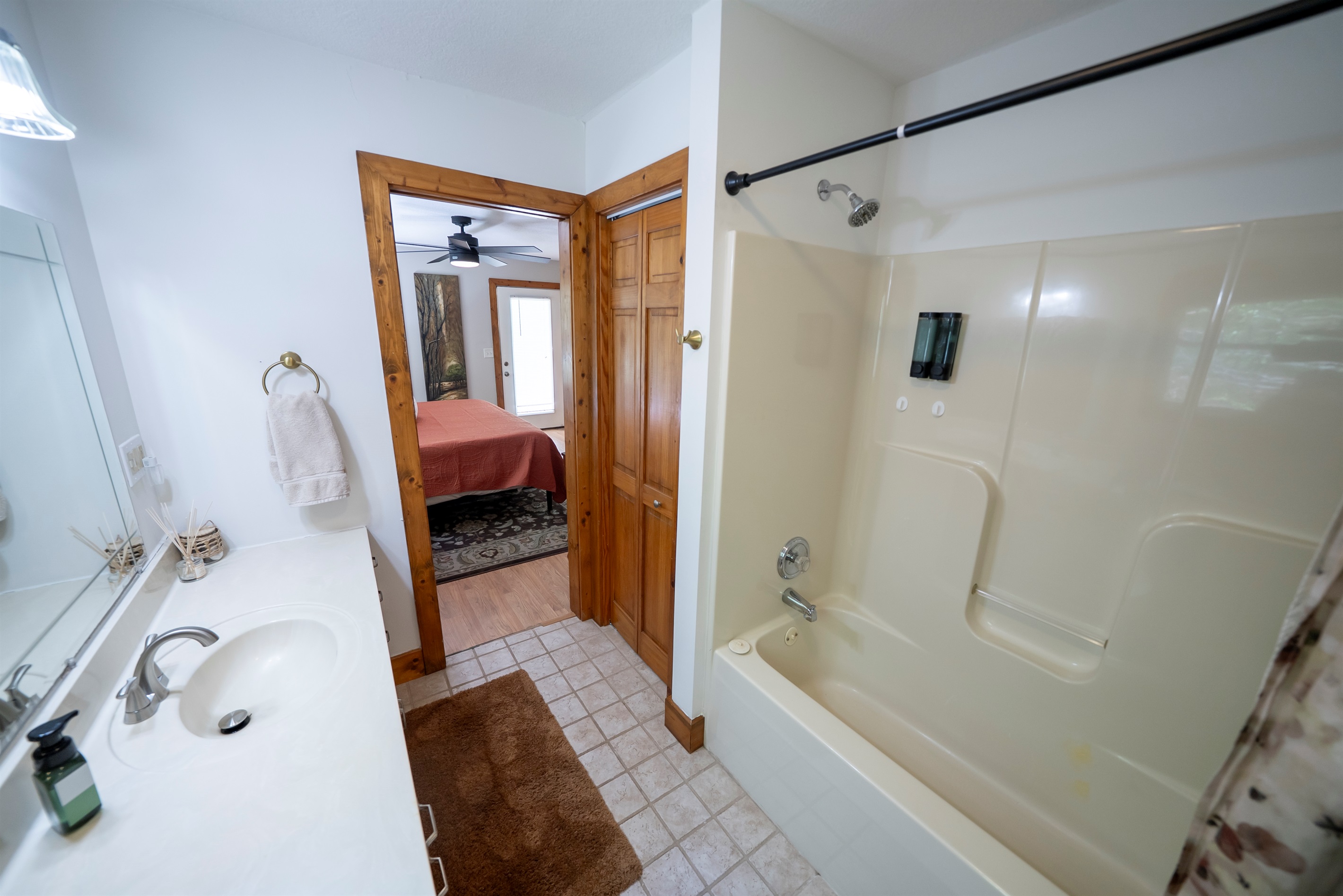 Clean and comfortable shower/tub combo for both convenience and relaxation.